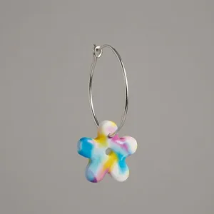 Handmade Buttercup polymer clay hoop flower earrings with stainless steel hoops.